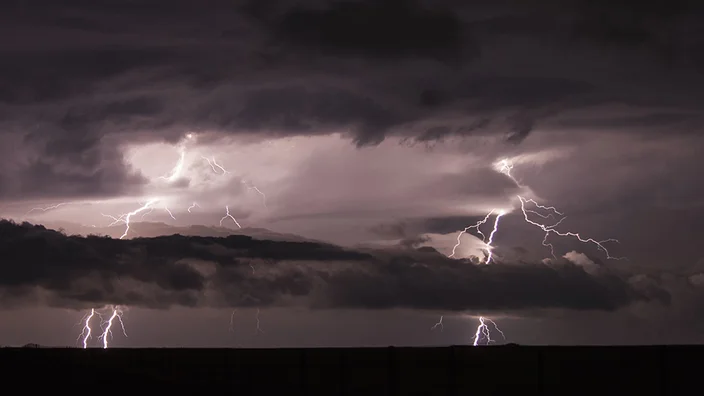 lightning-striking-during-a-nighttime-storm-2025-04-04-05-00-26-utc.jpg