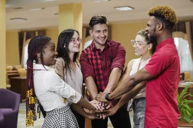 cheerful-people-posing-with-hands-stacked-3.jpg