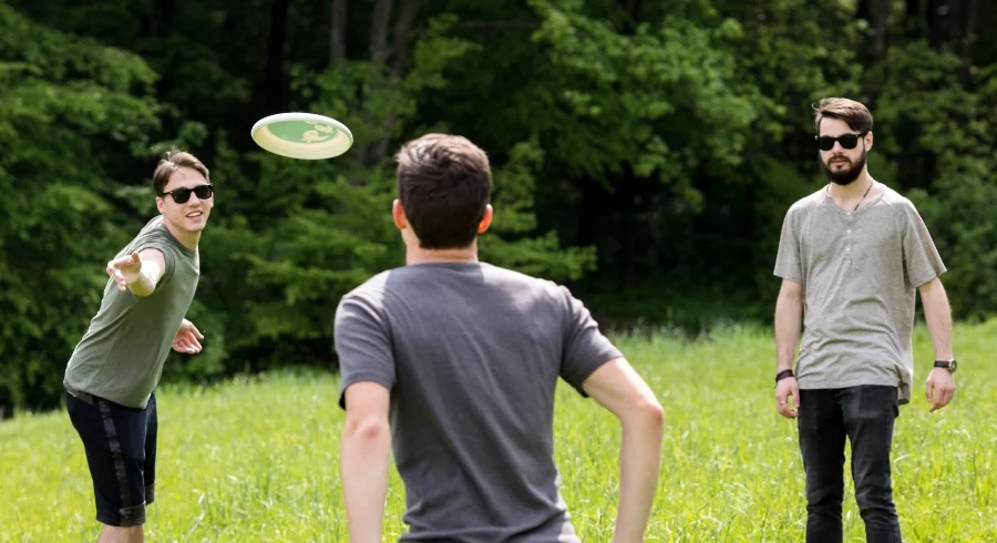 adult-men-having-fun-while-playing-frisbee_1.jpg